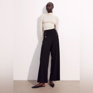 TROUSERS WITH DECORATIVE BUTTONS